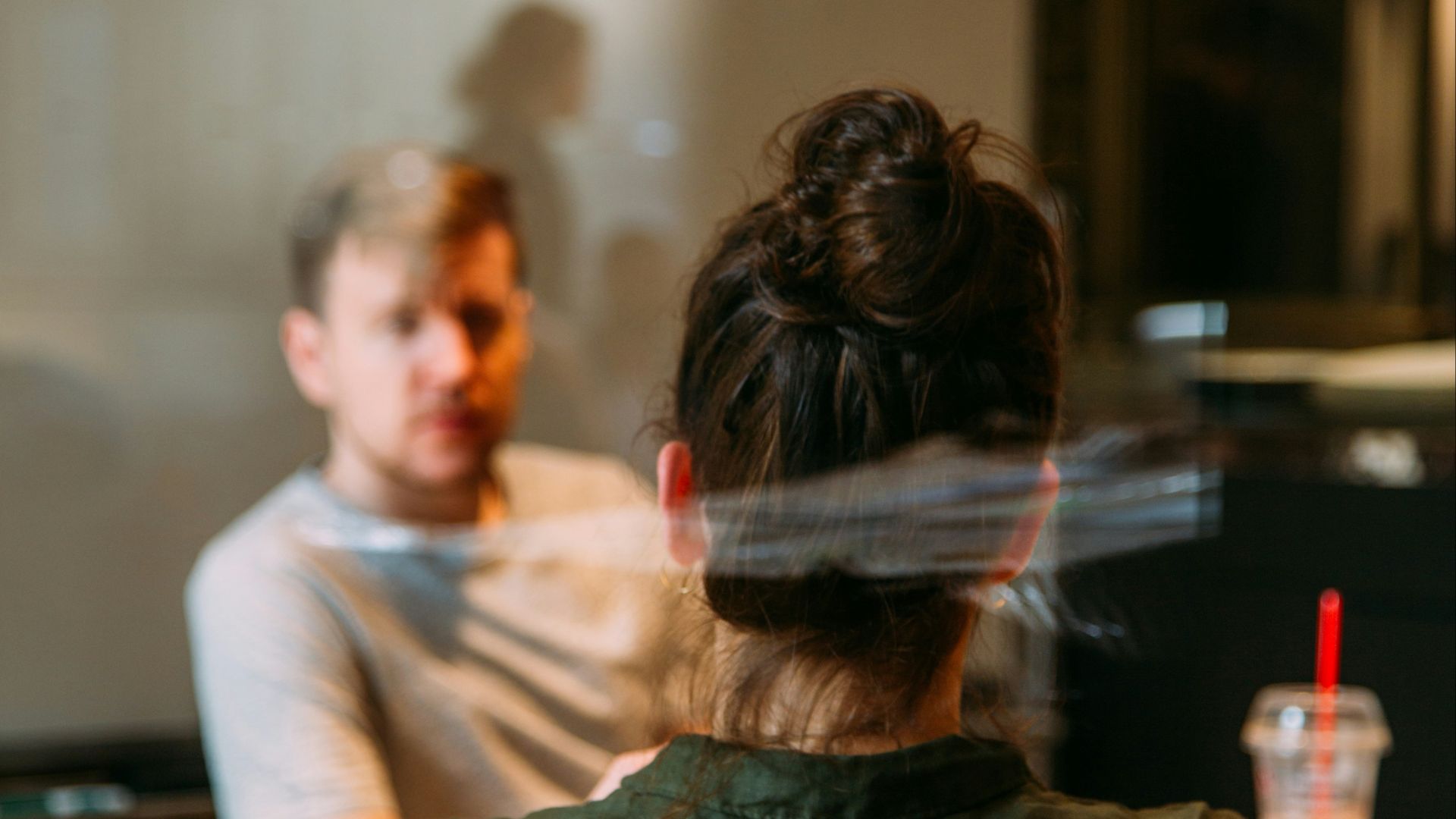 person sitting in a chair in front of a man