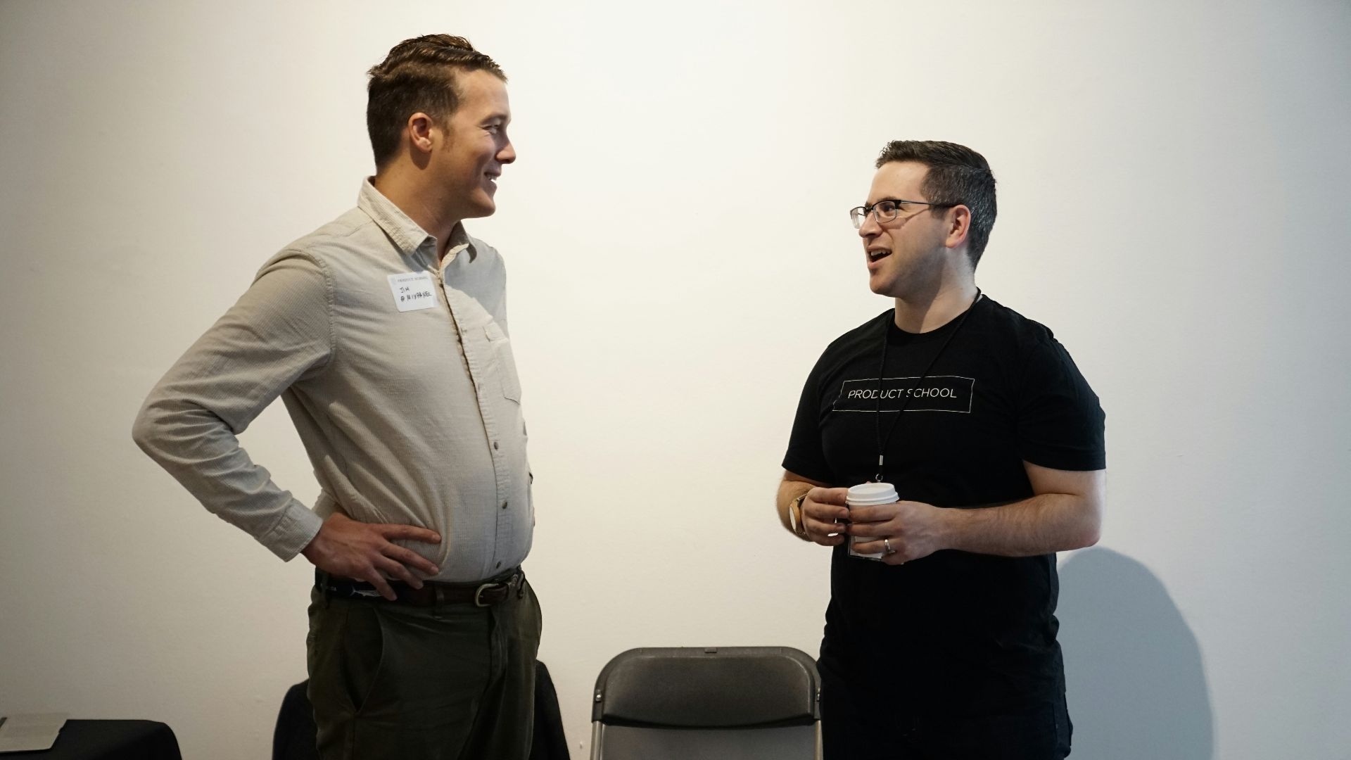 folding chair between two men