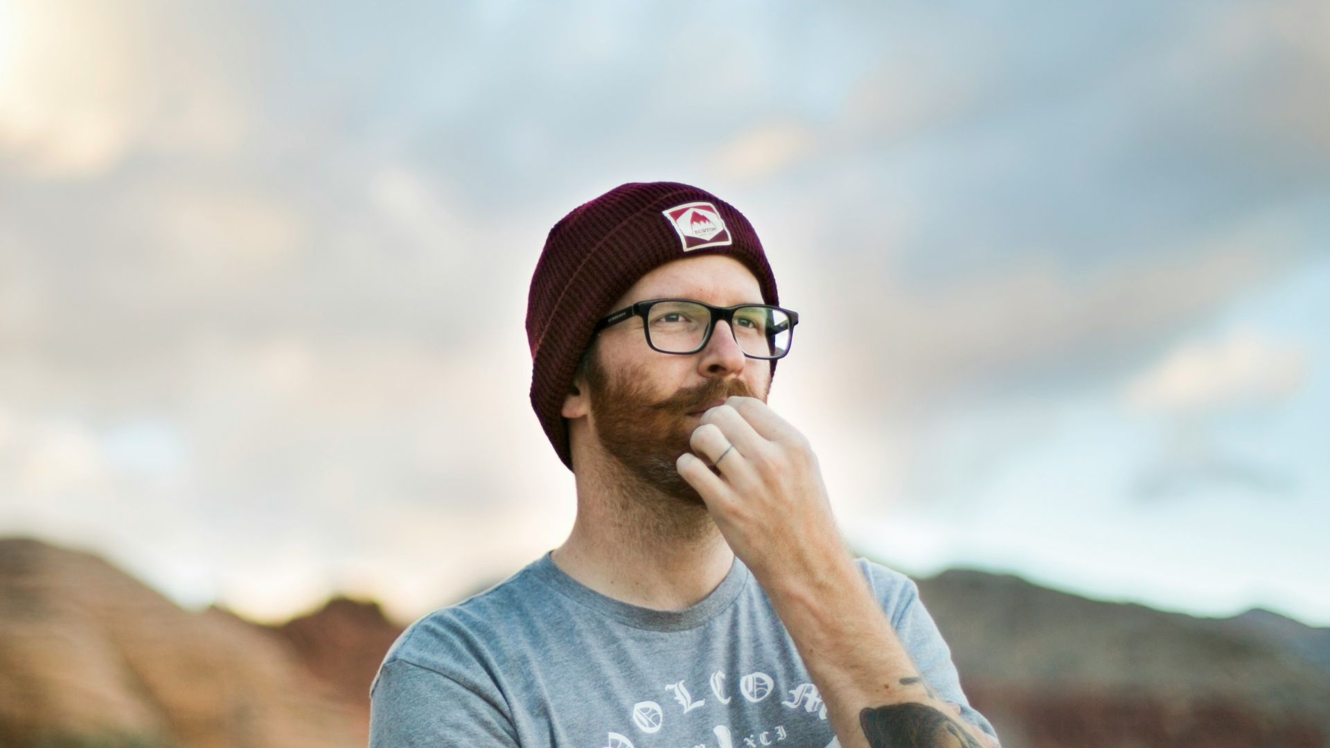 woman in blue crew neck t-shirt wearing black sunglasses
