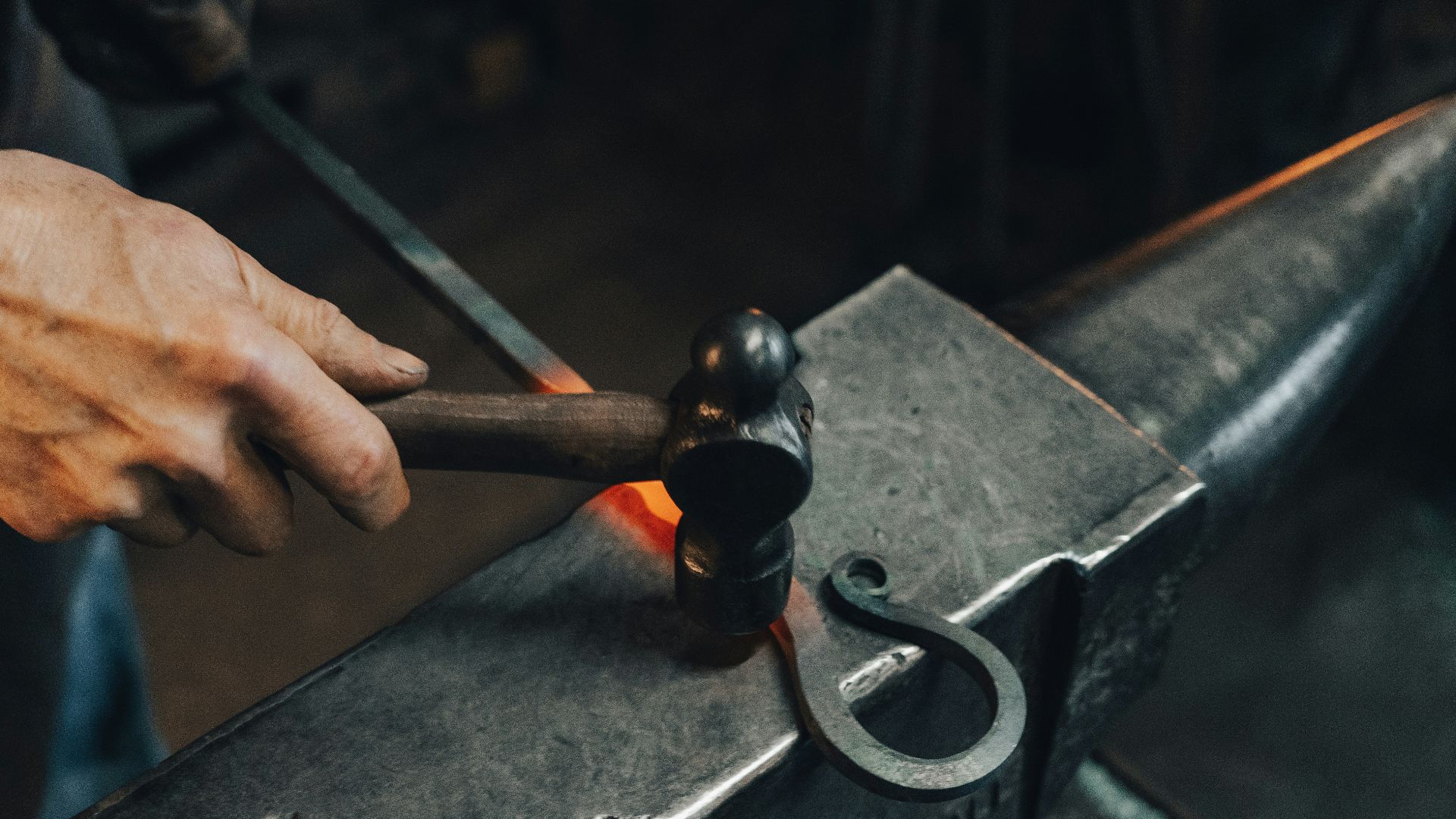 person holding black metal pipe