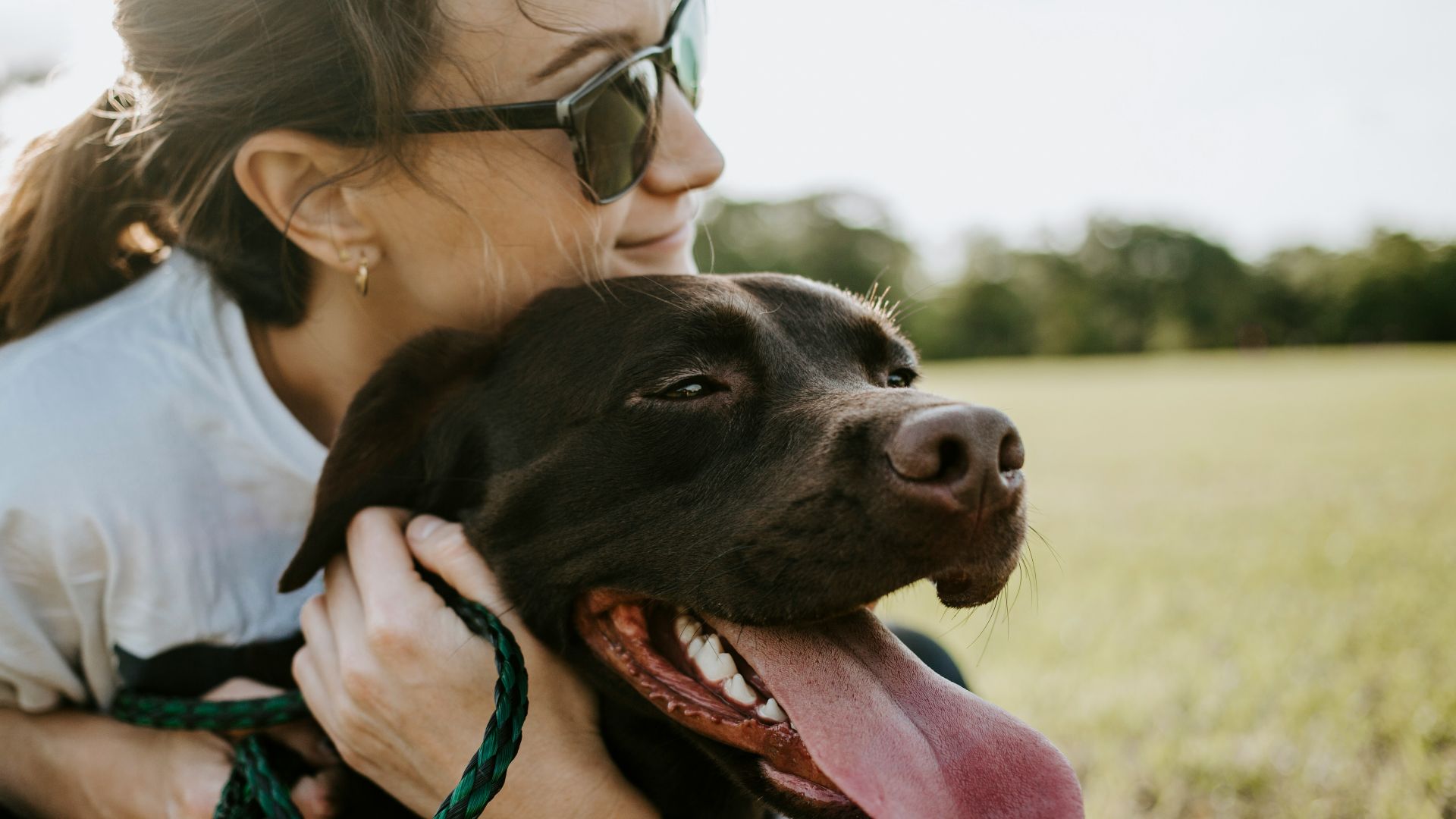 woman hugging a dog