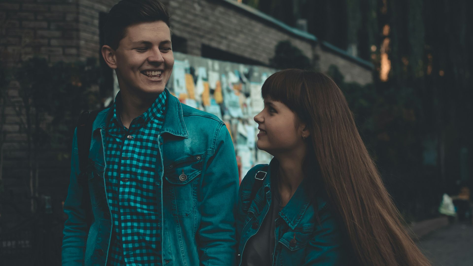 man and woman walking with each other