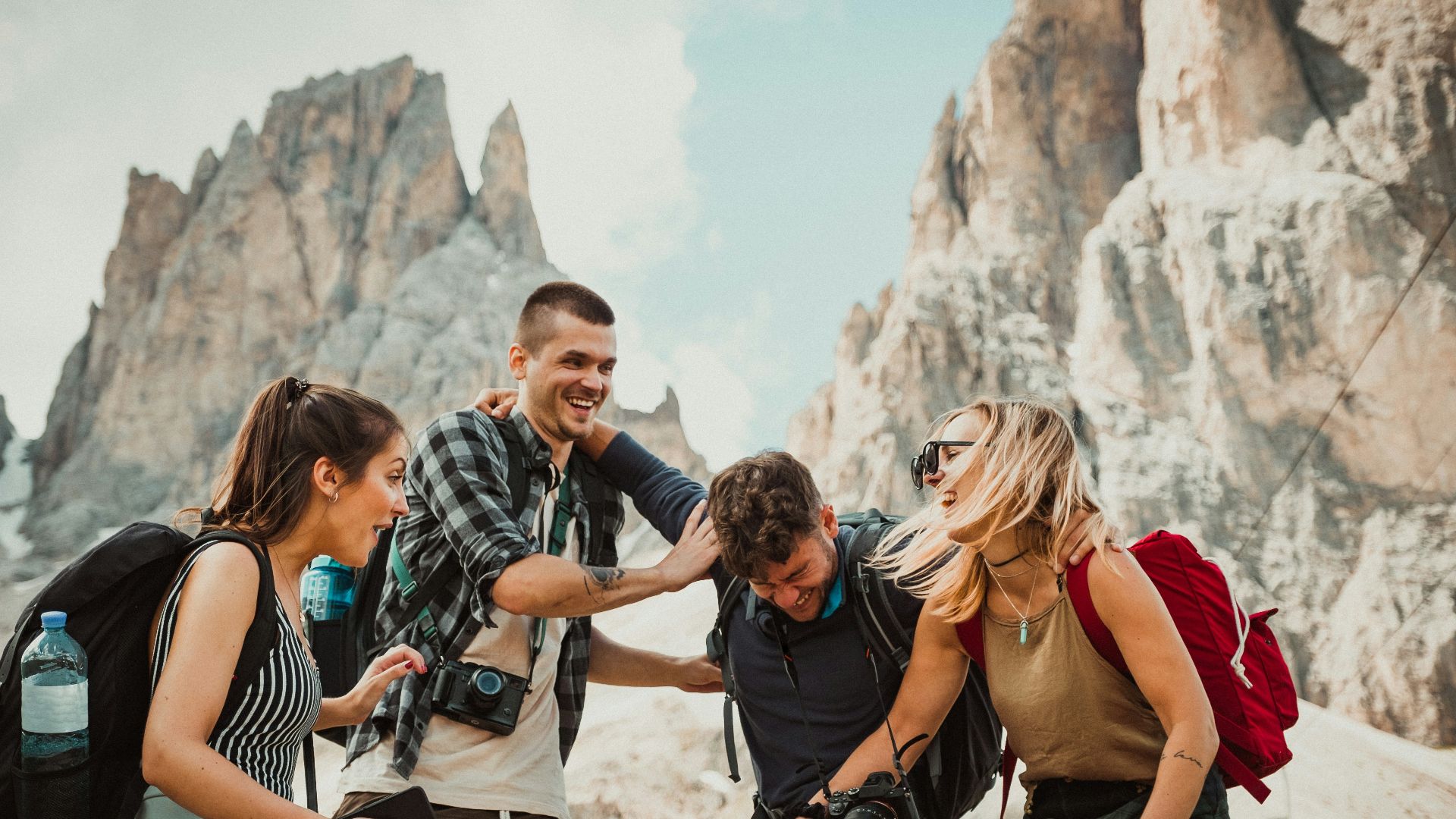 low-angle photography of two men playing beside two women