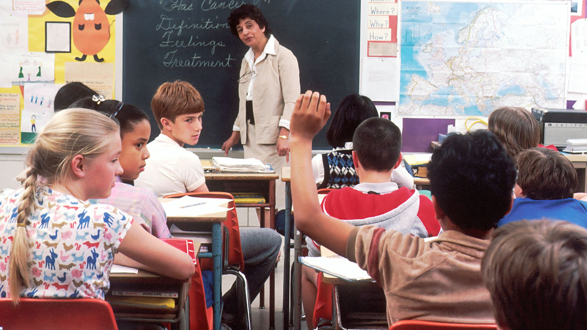 woman standing in front of children