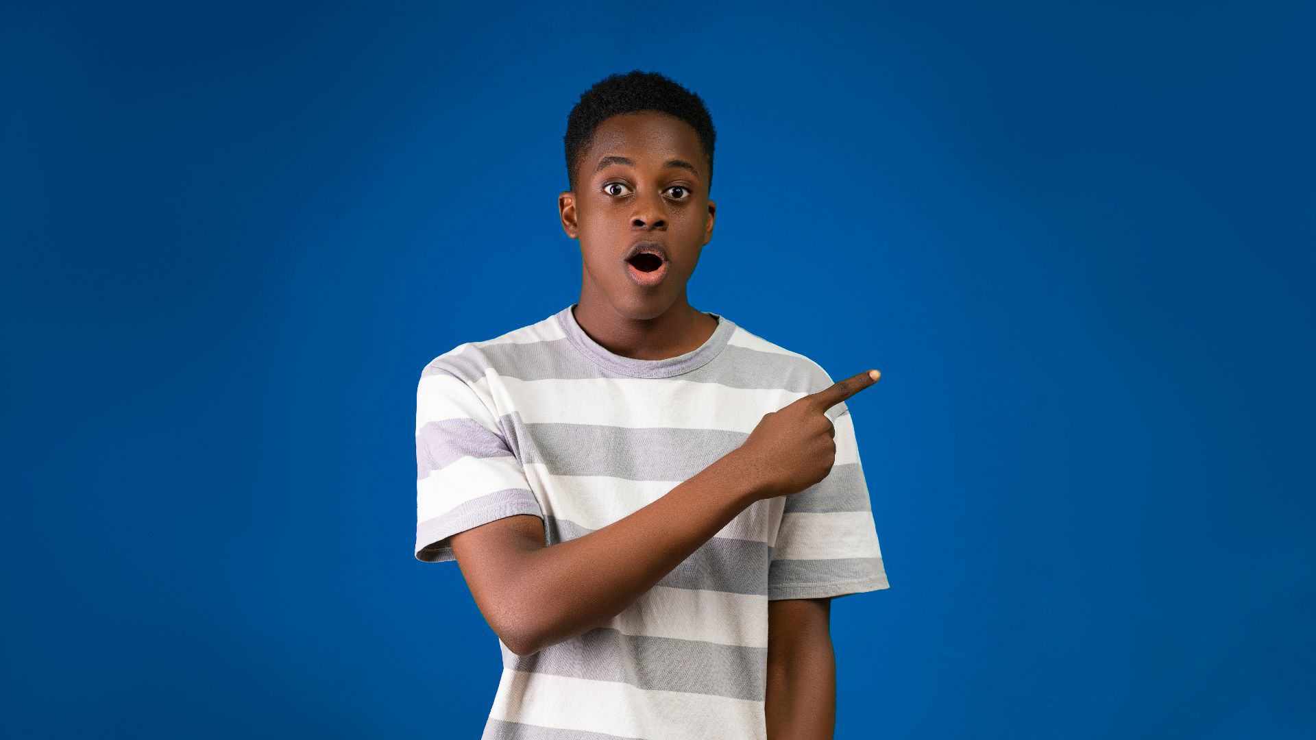 a boy holding a stick