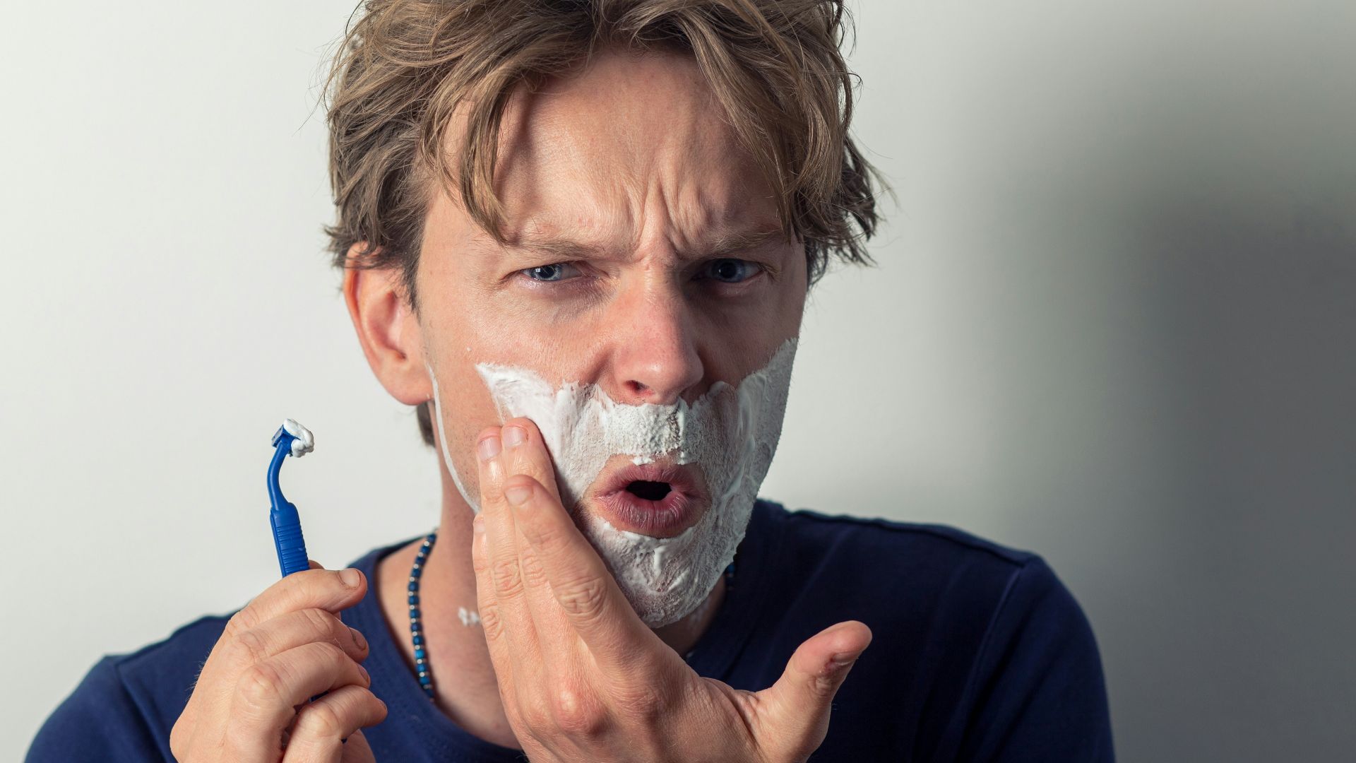 woman in blue long sleeve shirt with white face mask