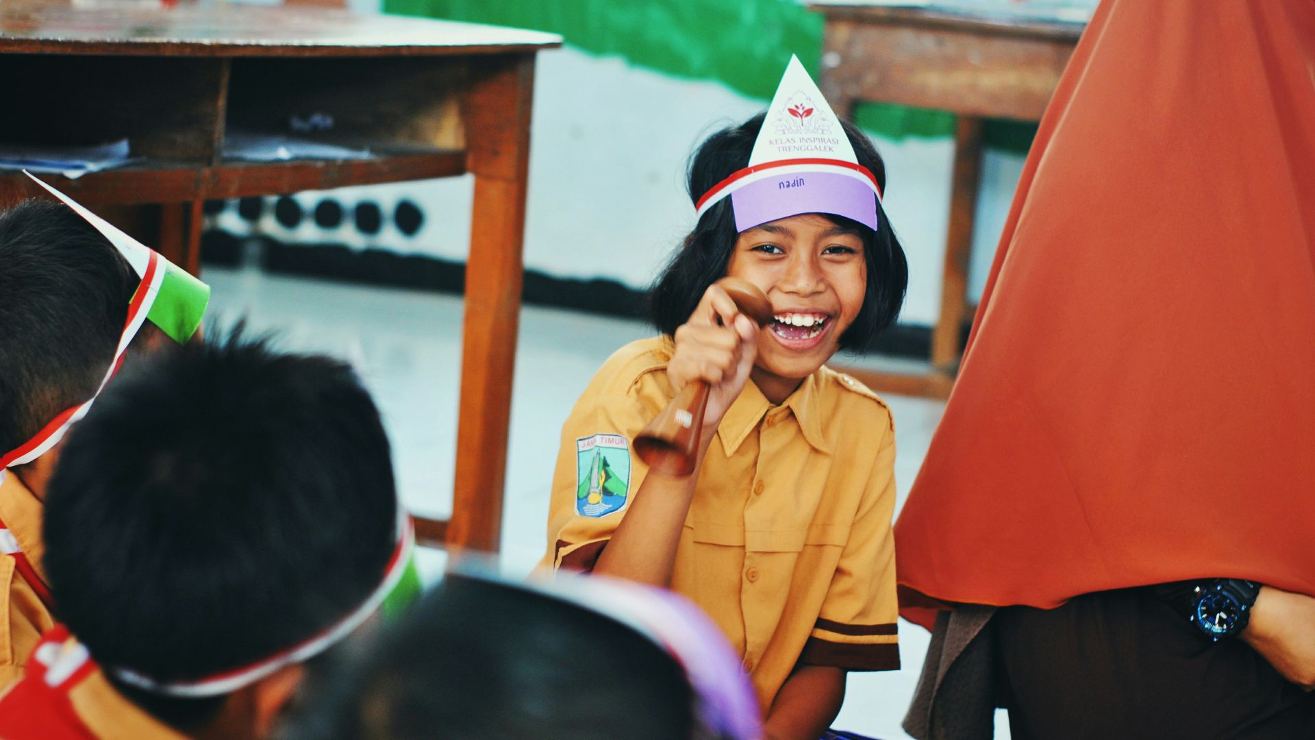woman in yellow polo shirt sitting on chair