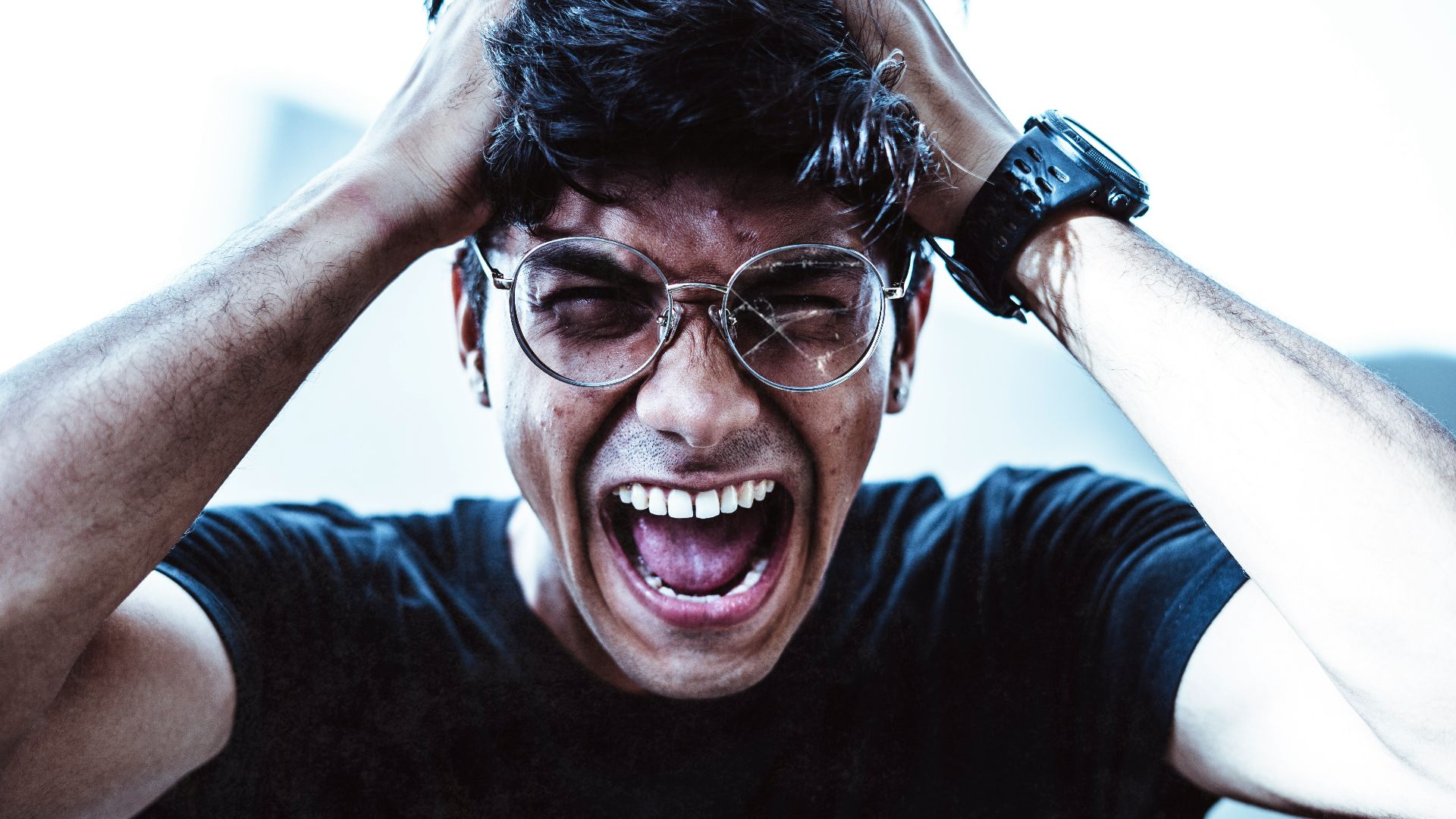 man in black crew neck t-shirt smiling