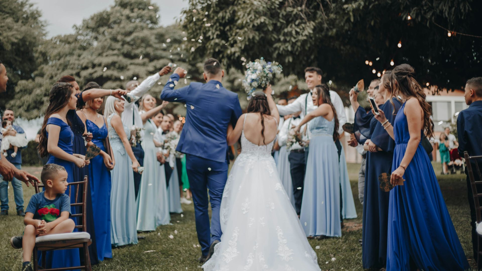 people in white dress dancing on green grass field during daytime