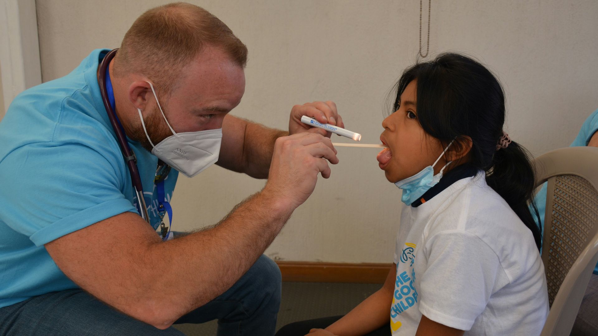 a doctor checking a patient's blood pressure