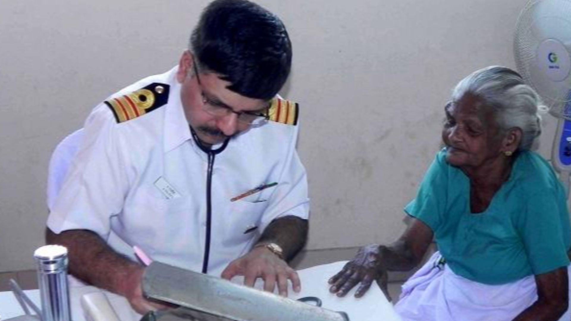 File:A Naval Doctor giving consultancy and treatment to an old lady of the village, at the Camp.JPG