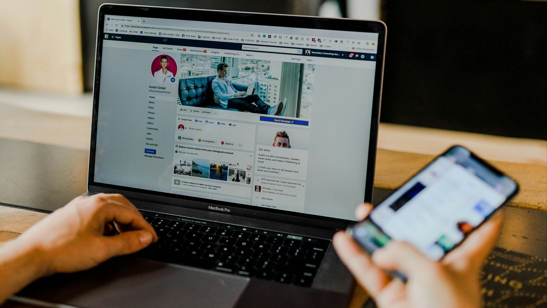 person using both laptop and smartphone