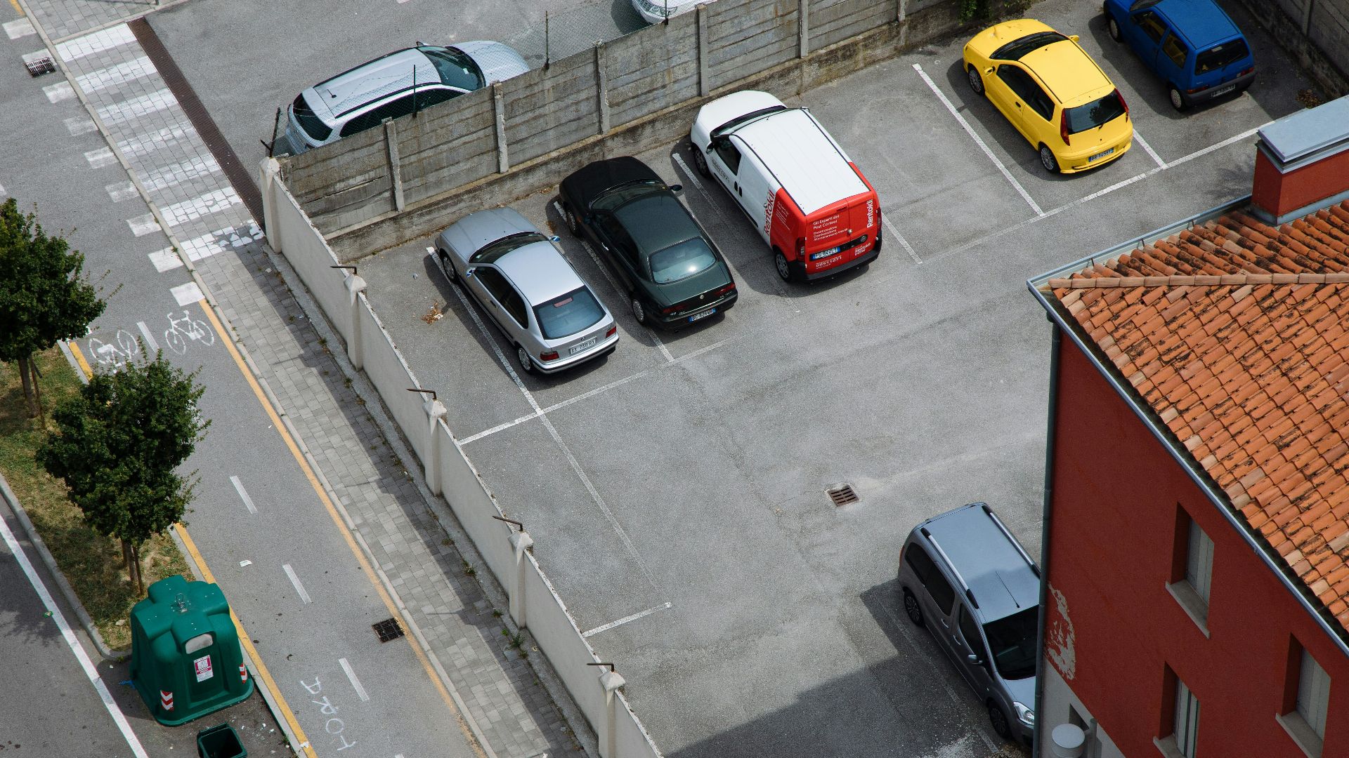 a parking lot with several cars parked in it