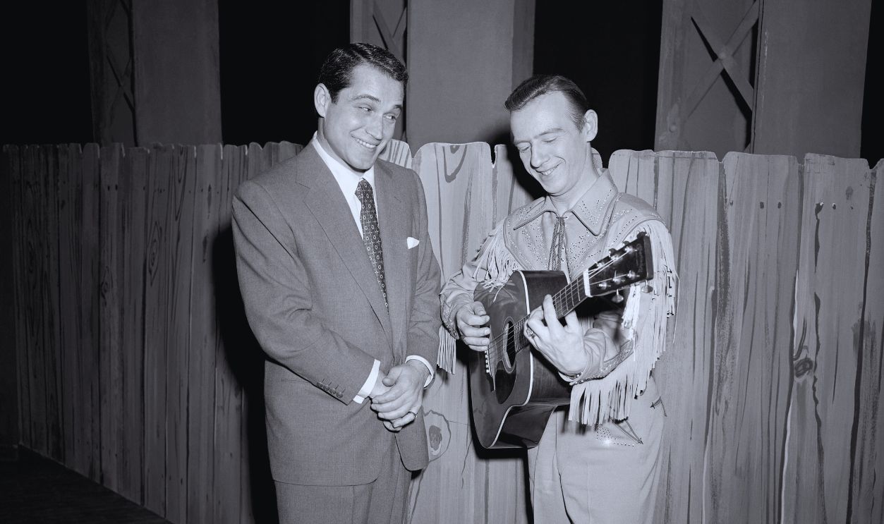 Gettyimages - 2182940068, The Perry Como Show (L-R) American singer and actor Perry Como (1912 - 2001) watches Canadian American guitarist and singer Hank Snow (1914 - 1999) play his guitar during the filming of 'The Perry Como Show' in New York, New York, February 27, 1952. 
