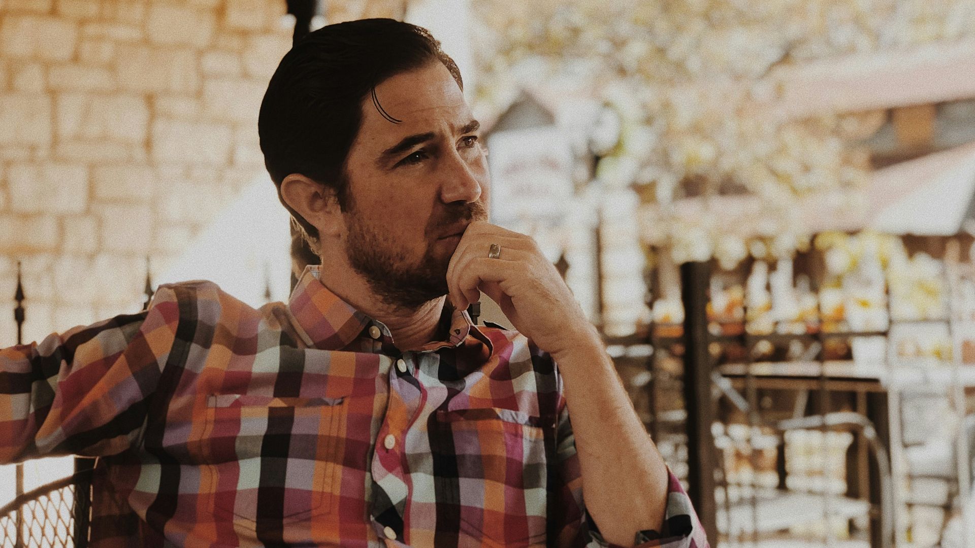 man in red and black plaid dress shirt