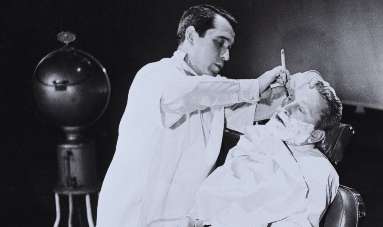 Gettyimages - 515455574, Perry Como and Kirk Douglas (Original Caption) Crooner Perry Como, who was a barber before his stardom in the entertainment world, proves to actor Kirk Douglas he's still a handy guy with a razor and clippers, as he shaves off Kirk's beard on his television show. Kirk has grown the beaver for his latest film. 