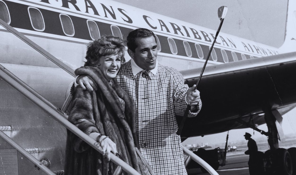 Gettyimages - 526740073, Perry Como And Dorothy Collins Singers Perry Como and Dorothy Collins smiling on the steps of an airplane, boarding a flight to Guantanamo Naval Base to perform for the personnel, New York, December 4th 1962.