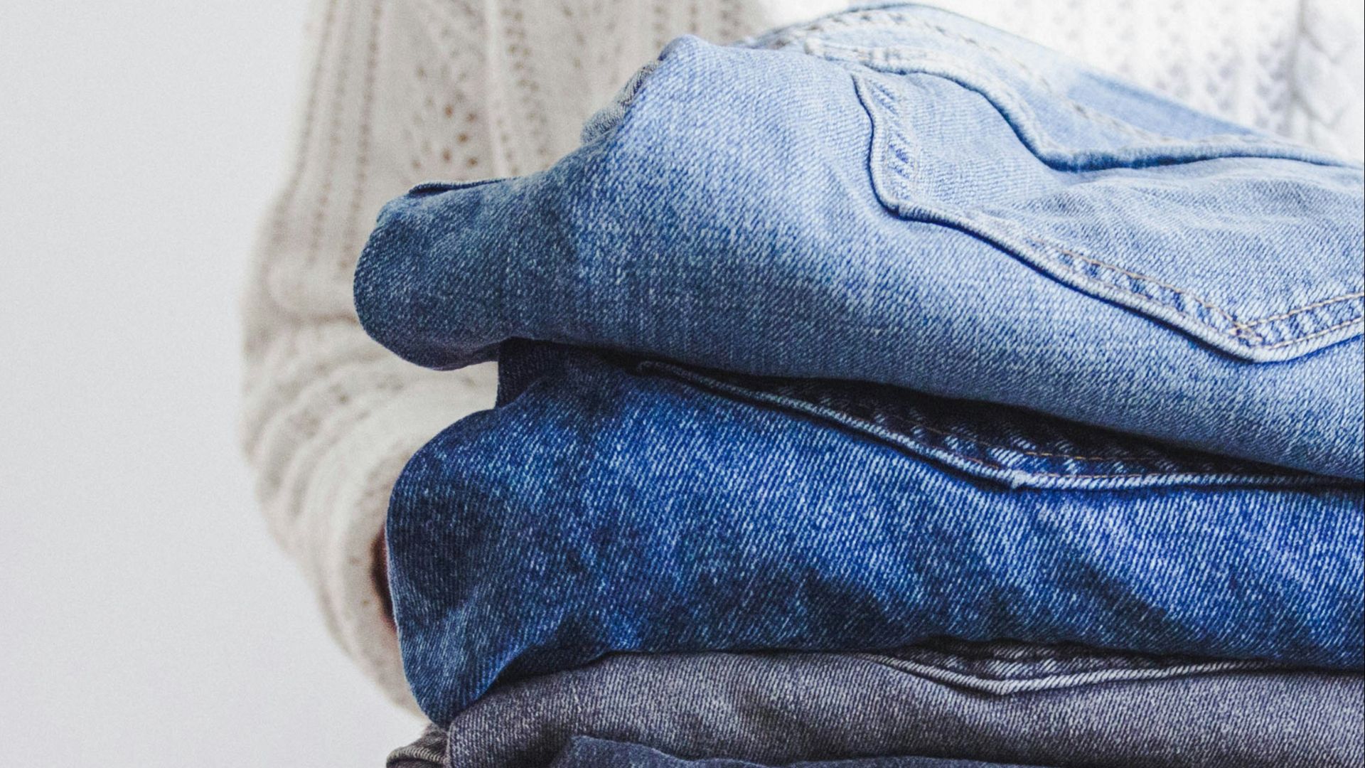 blue and white textile on white textile