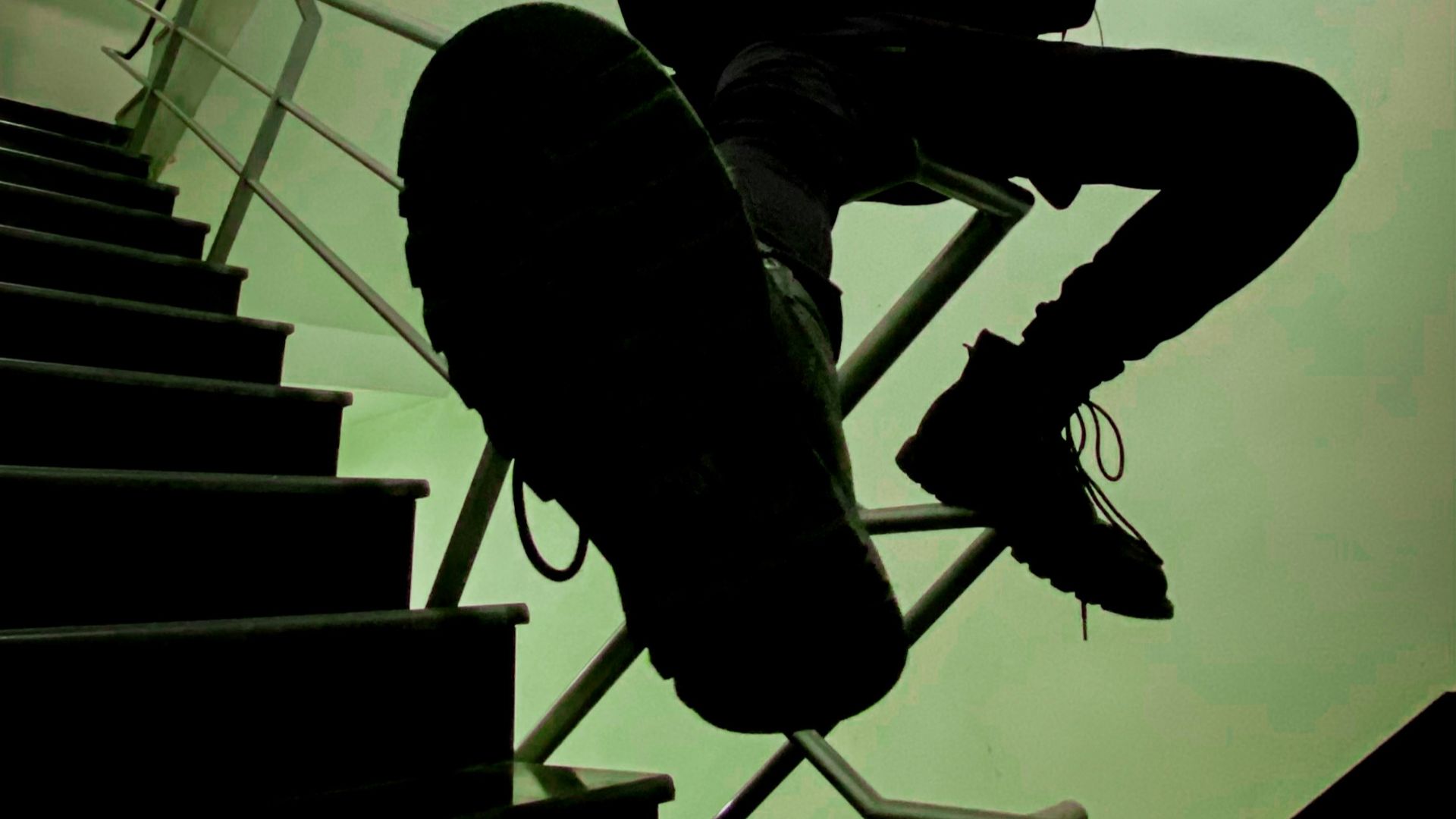 a man sitting on top of a stair case