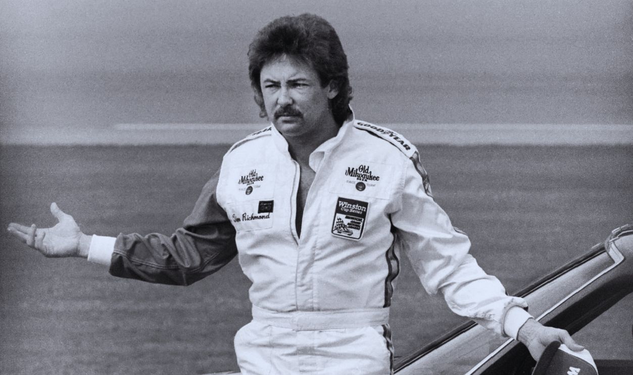 Gettyimages - 136253361, 1983 Firecracker 400 DAYTONA BEACH, FL - JULY 3, 1983: NASCAR driver Tim Richmond poses for photographers after qualifying for the 1983 Firecracker 400 on July 3, 1983 at the Daytona International Speedway in Daytona Beach, Florida. 