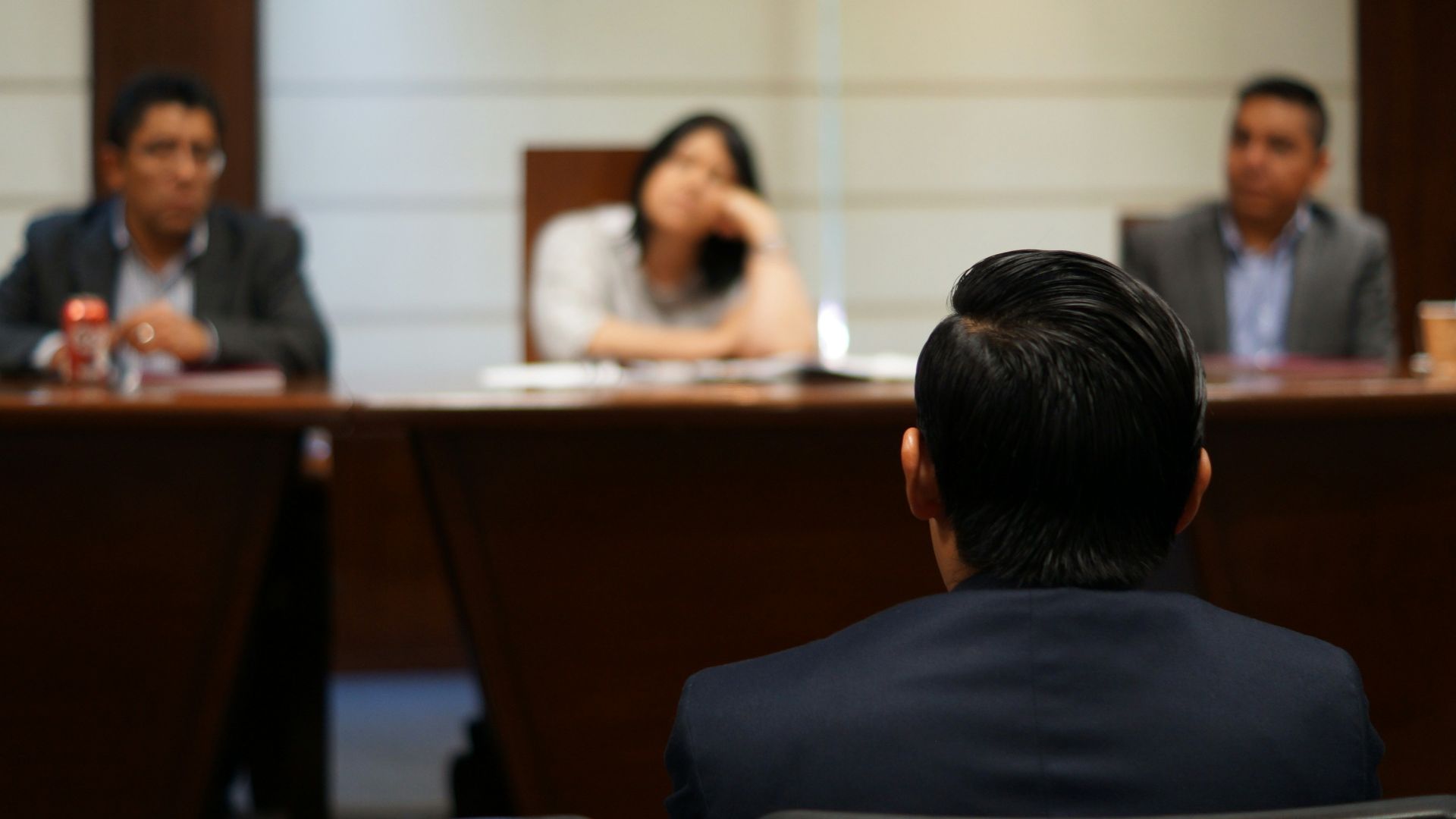 man in black shirt sitting beside woman in white shirt