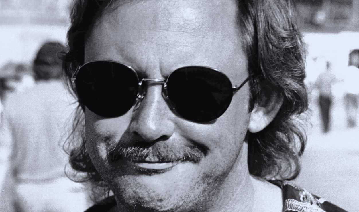 Gettyimages - 118961471, 1984 Firecracker 400 DAYTONA BEACH, FL - JULY 3, 1984: NASCAR driver Tim Richmond relaxes in the Daytona International Speedway garage area after qualifying for the 1984 Firecracker 400 on July 3, 1984 in Daytona Beach, Florida. 