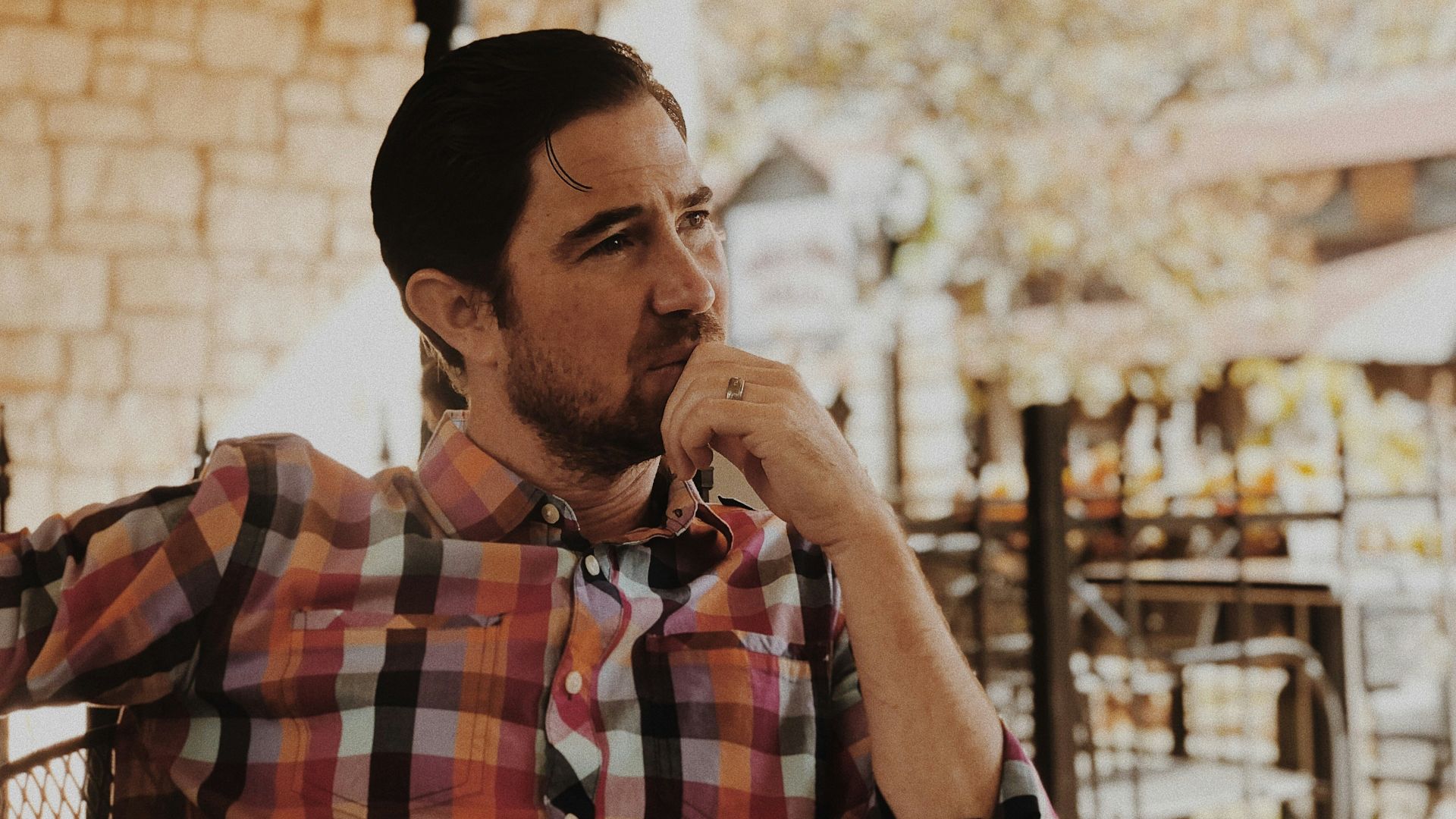 man in red and black plaid dress shirt