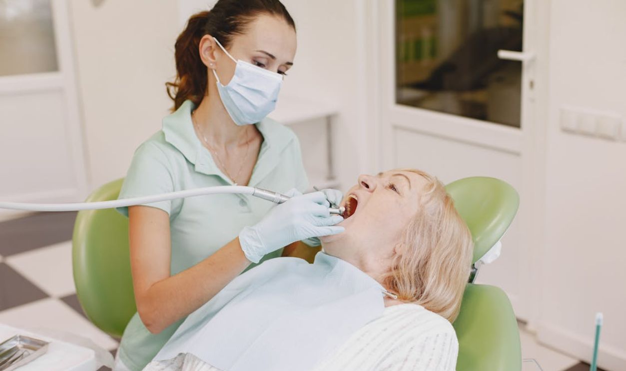 Dentist Checking on Patient's Teeth