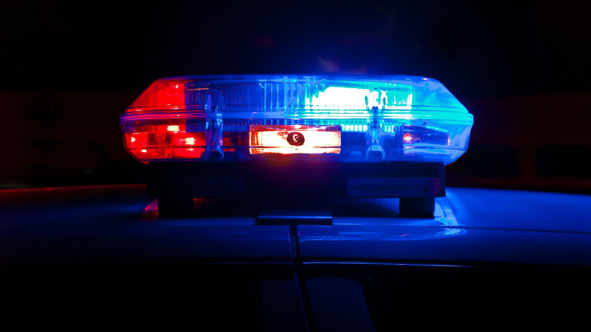 blue bmw car in a dark room