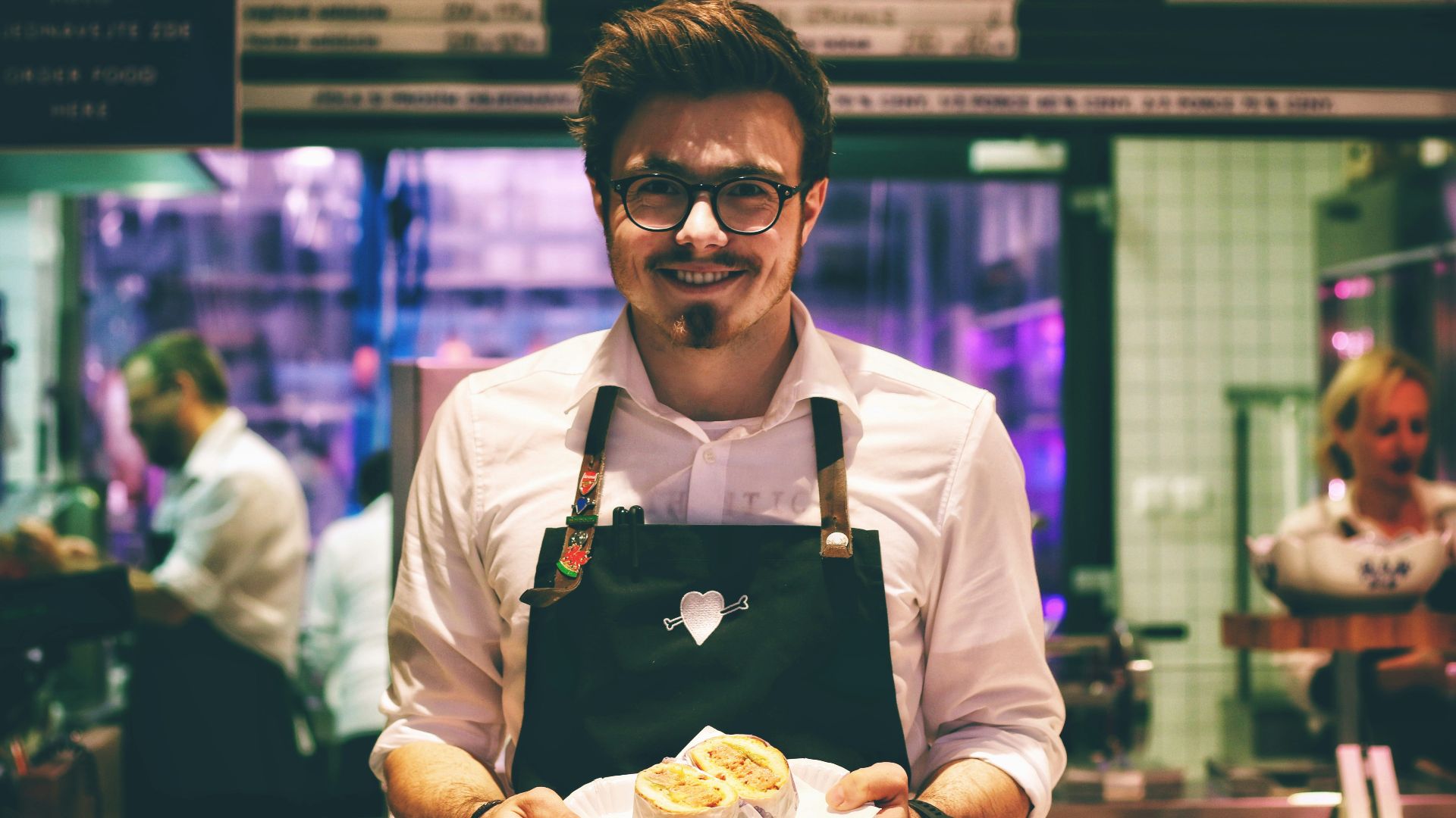 man holding fish dish on plate