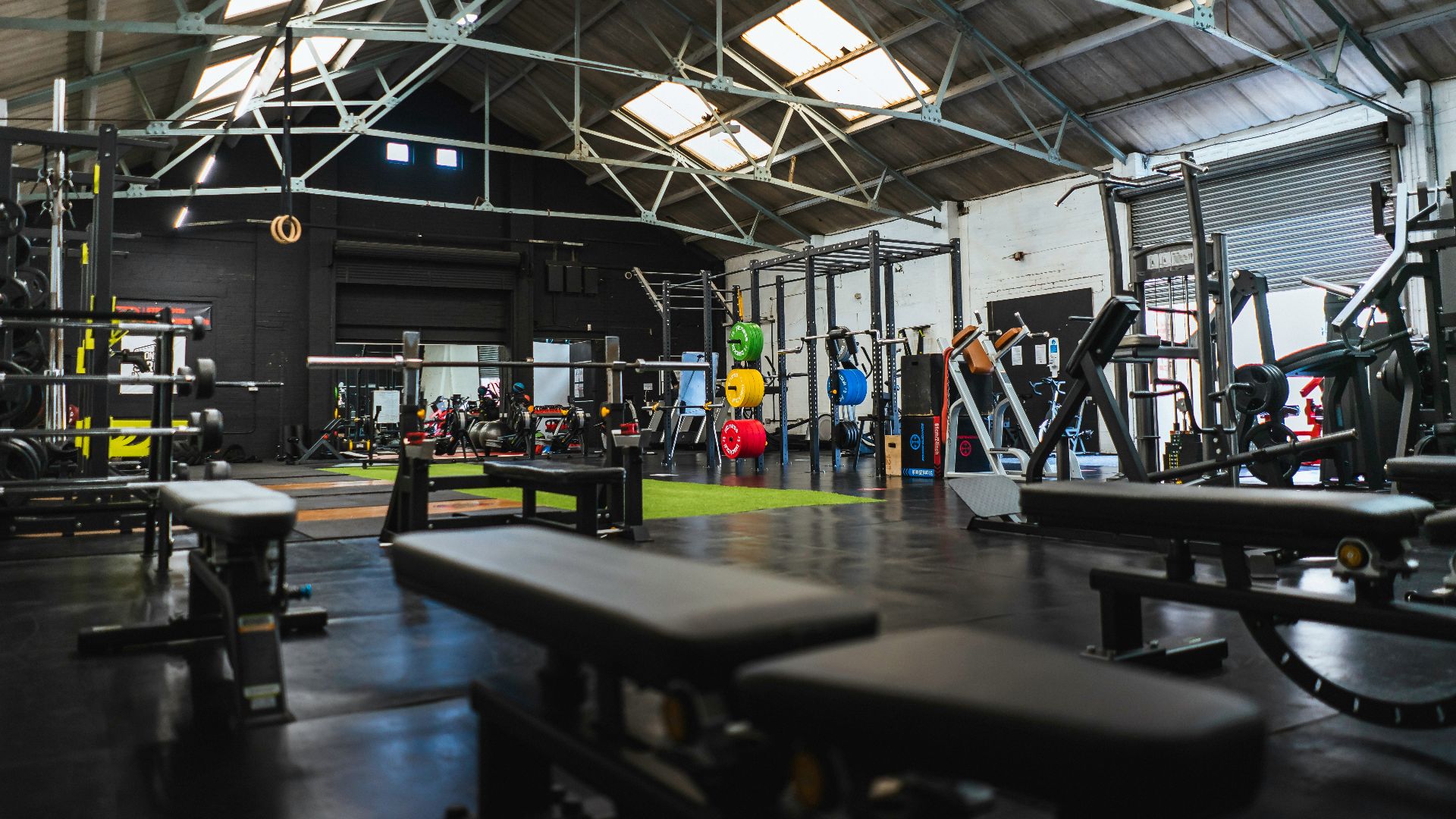 people in a room with a black table and chairs