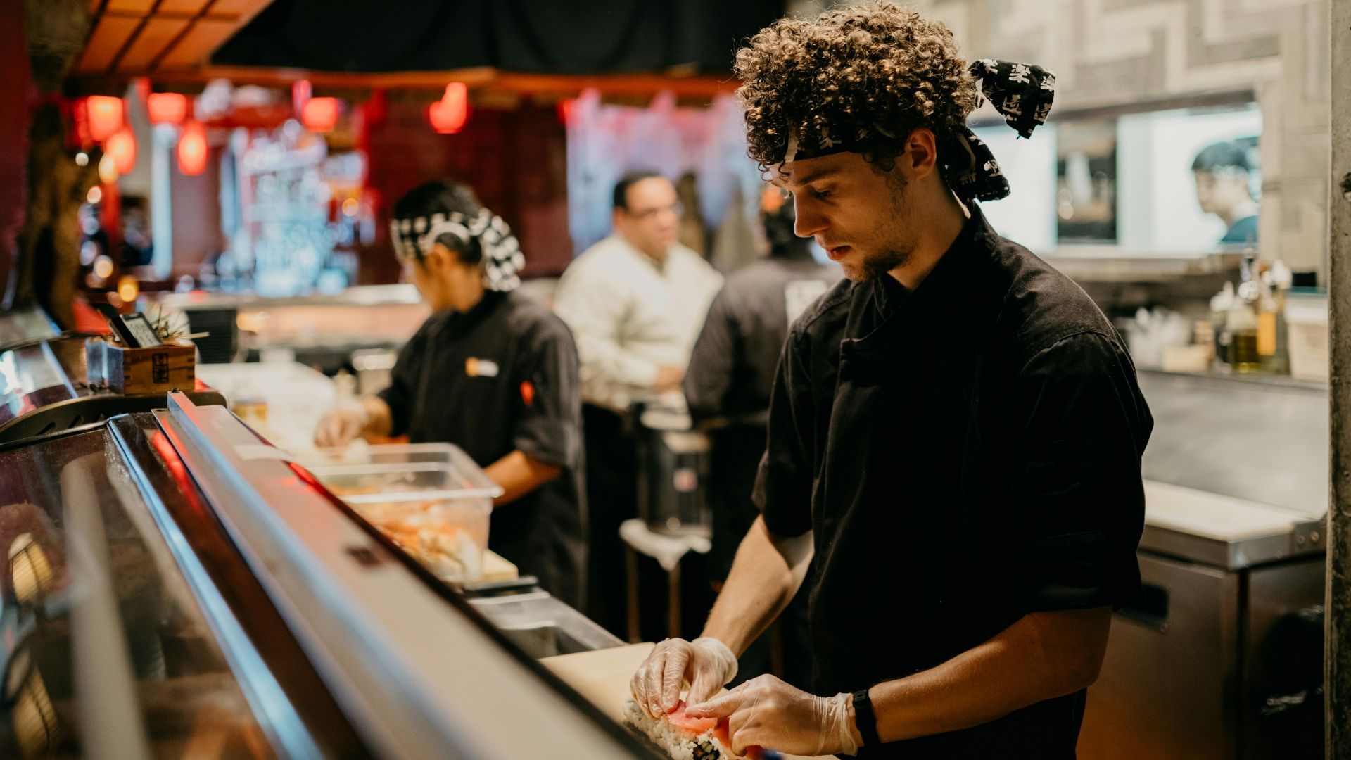 a group of people in a kitchen