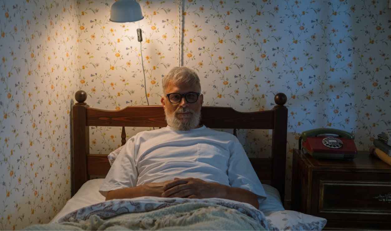 Elderly Man in Bed