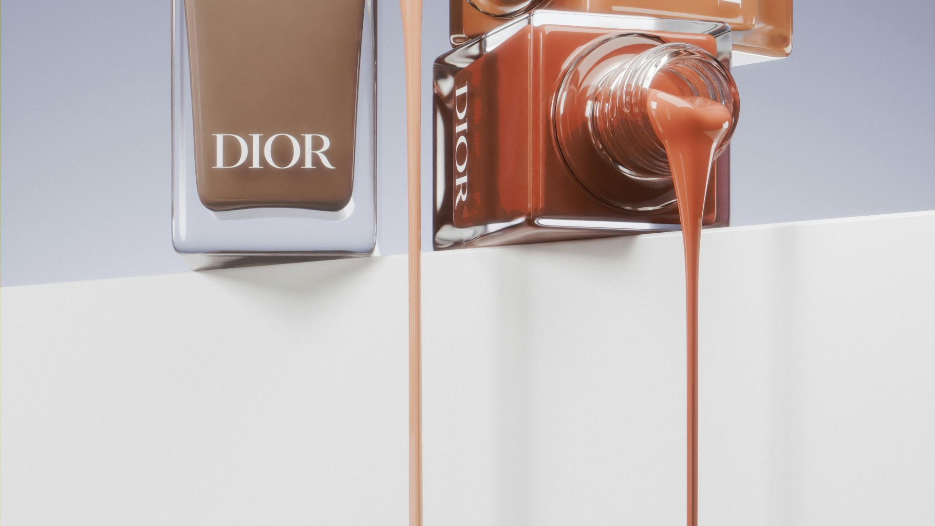 A bottle of dior's nail polish next to a bottle of dior