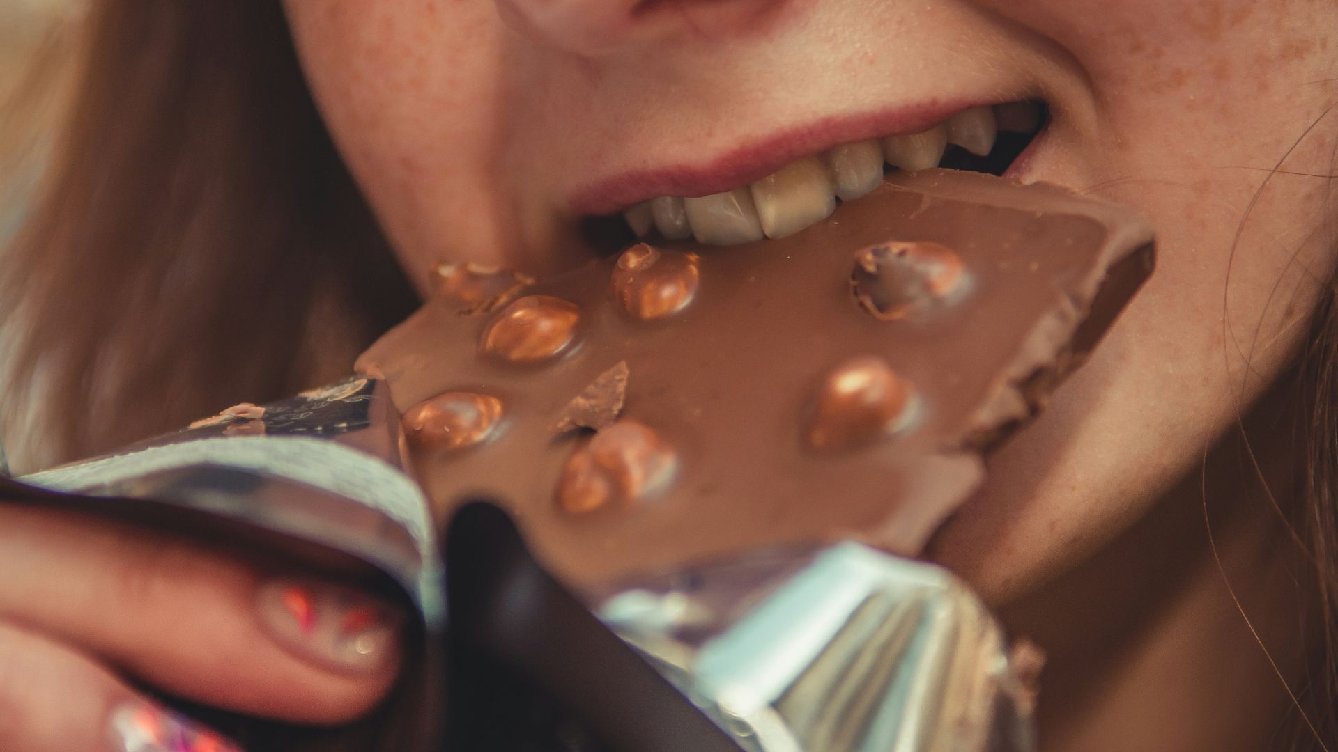 woman eating chocolate
