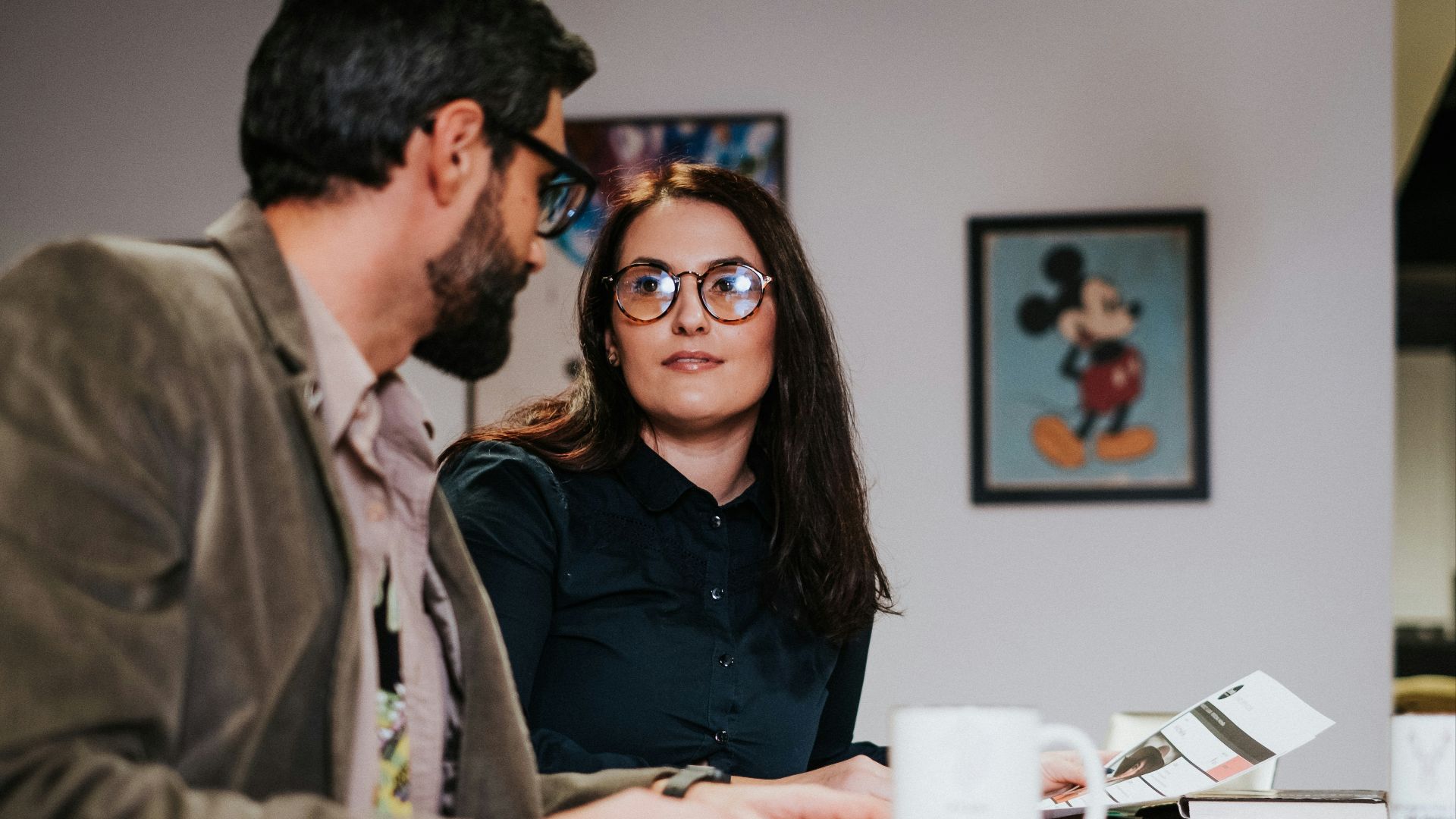 man and woman sitting at table
