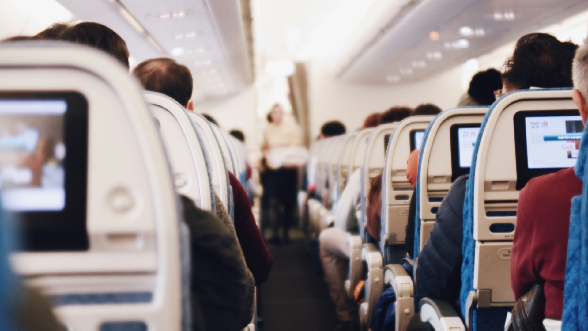 shallow focus photography of people inside of passenger plane
