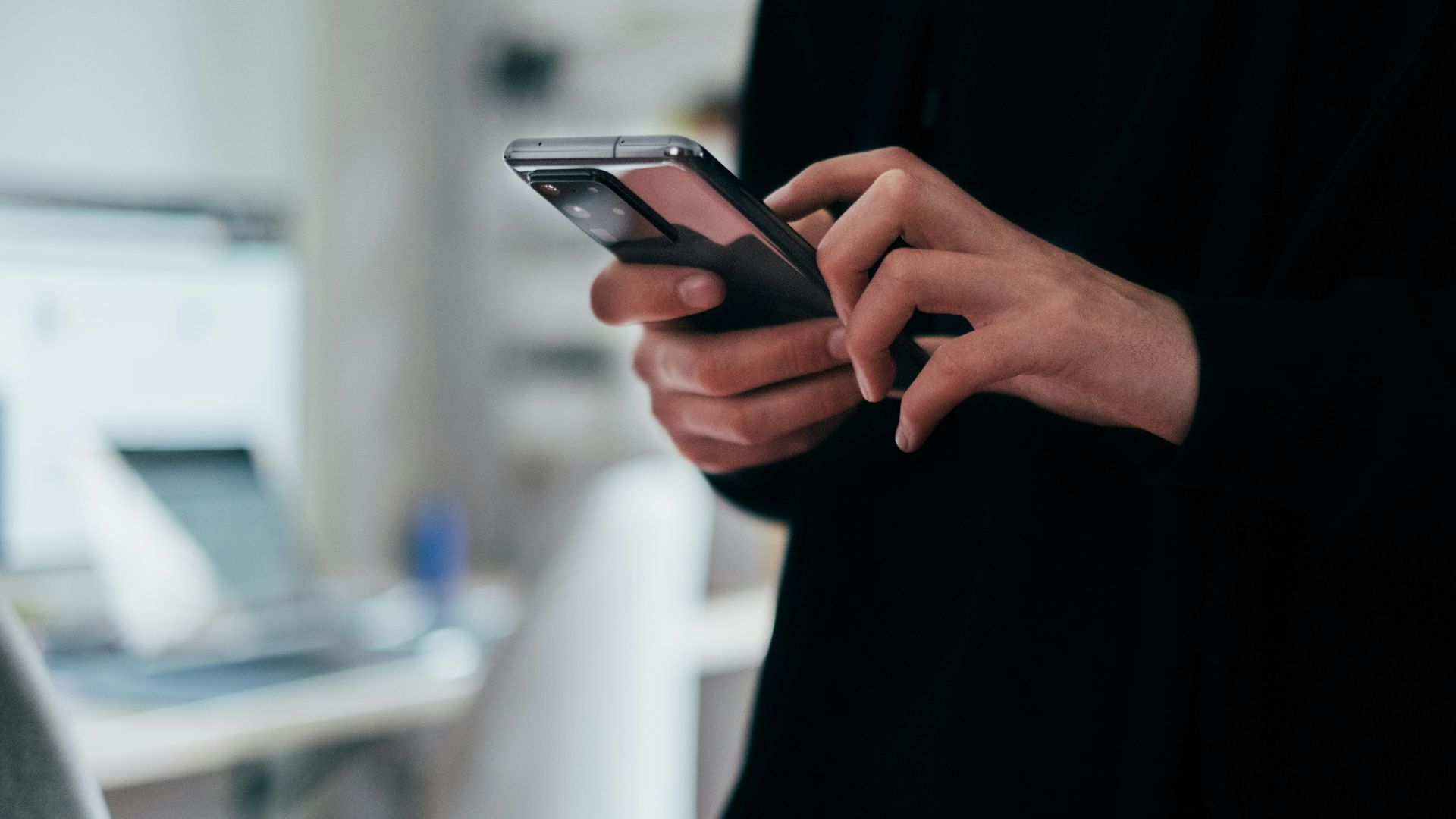 person holding black android smartphone