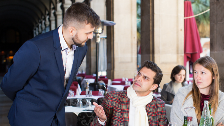 Couple angry at the waiter