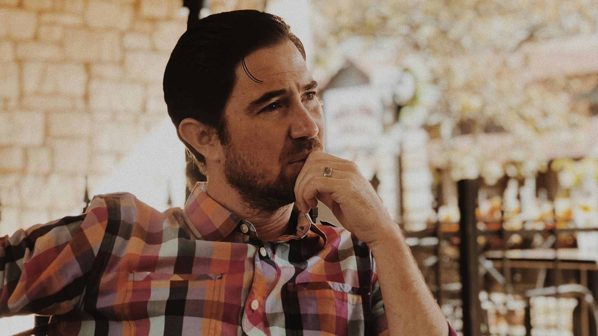 man in red and black plaid dress shirt