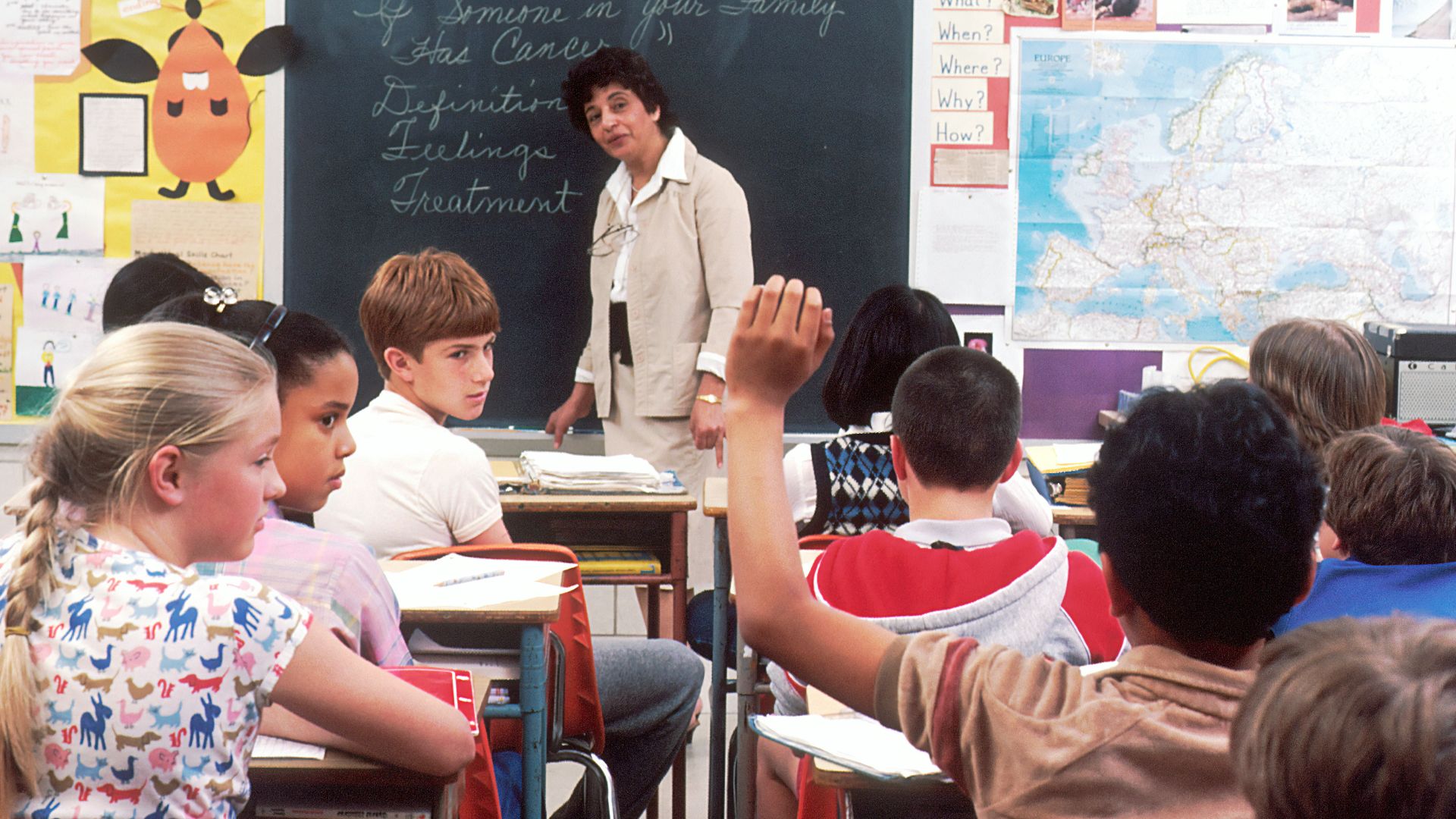 woman standing in front of children