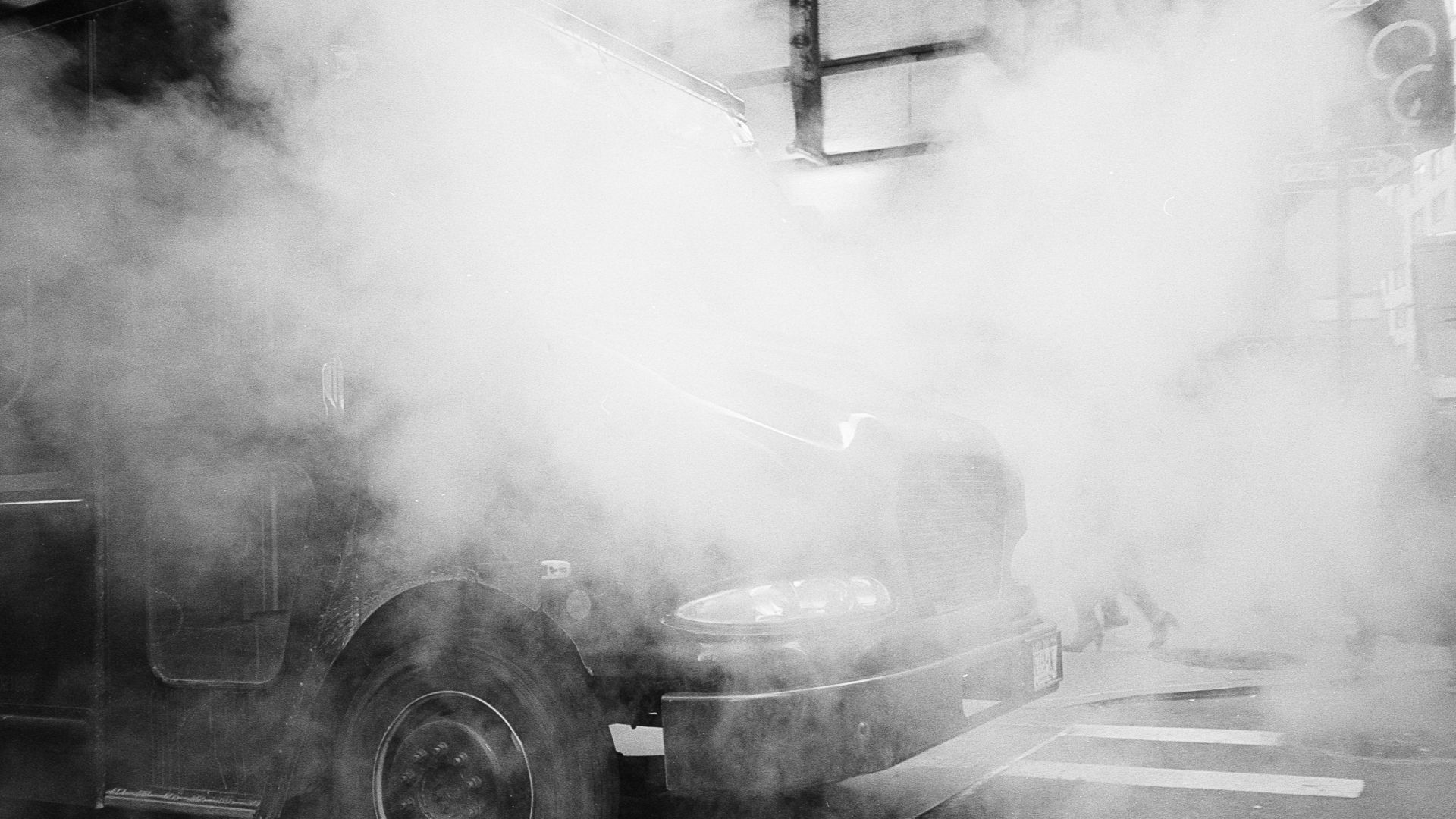 grayscale photo of classic vehicle