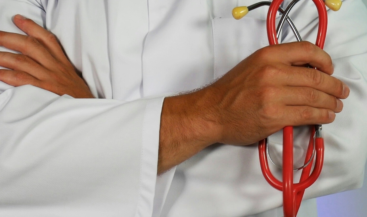 Doctor Holding Red Stethoscope