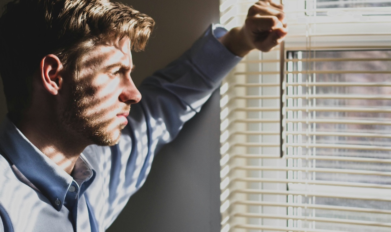 Person Near Clear Glass Window Pane