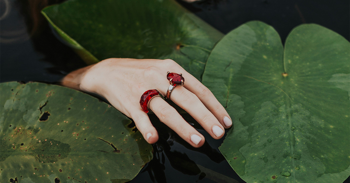 hand with colorful rings