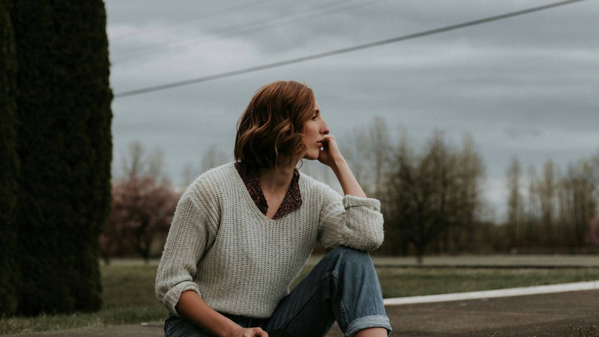 woman sitting on ground