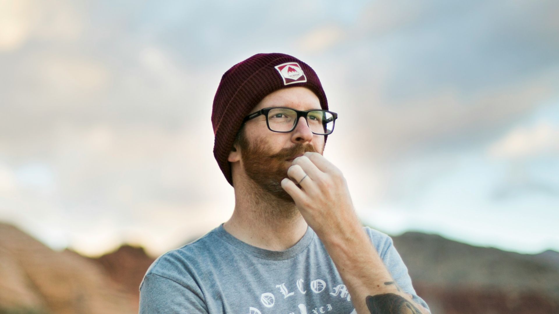 woman in blue crew neck t-shirt wearing black sunglasses