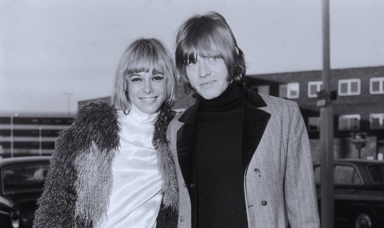Gettyimages - 2696431, Jones And Pallenberg 19-year-old actress Anita Pallenberg with Brian Jones (1942 - 1969), guitarist and founder member of the Rolling Stones pop band. She has just flown in from Munich to Heathrow airport amid rumours that she is to marry Brian.