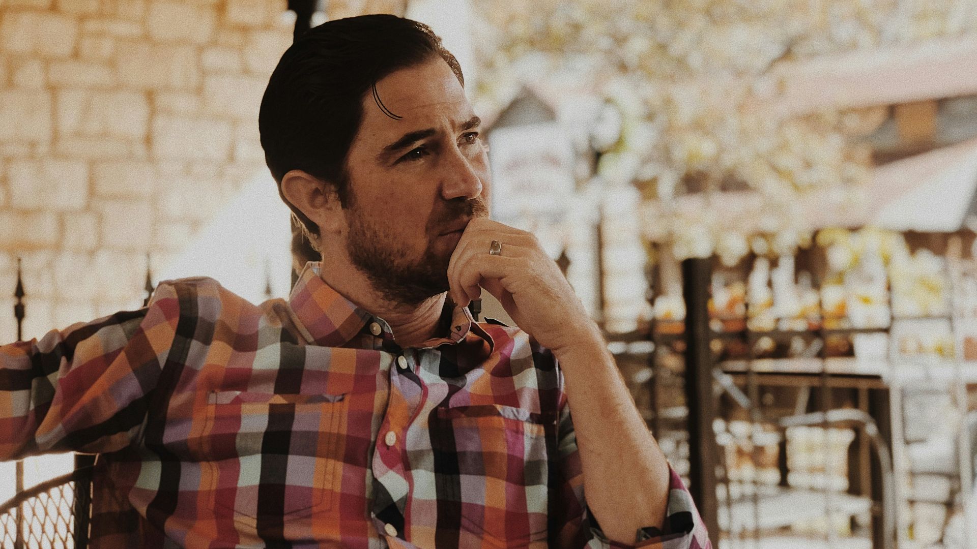 man in red and black plaid dress shirt