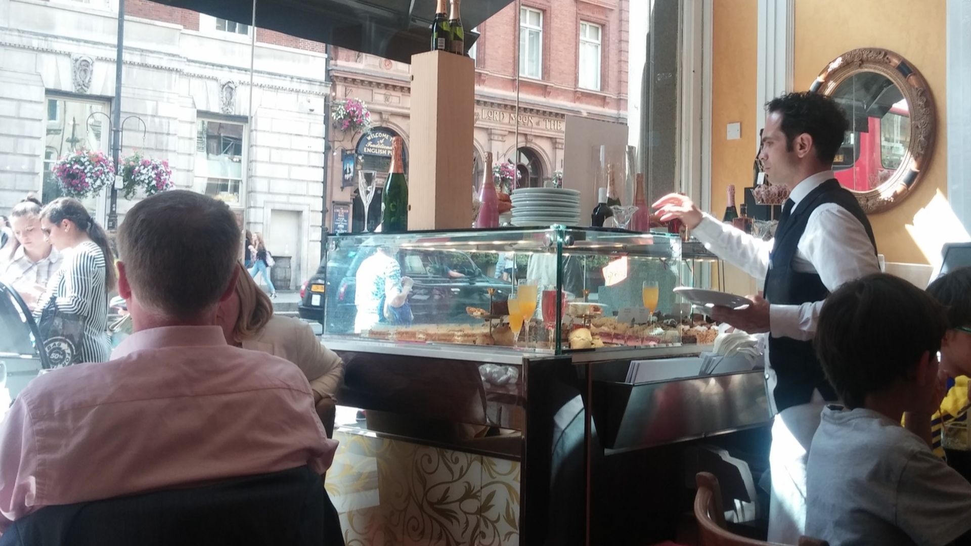 File:Waiter at Clarence Pub, London.jpg